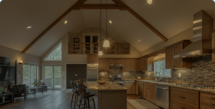 Photograph of a luxurious open-concept kitchen and living area with vaulted ceilings, modern amenities, and a strong connection to nature, evoking comfort and aspiration.